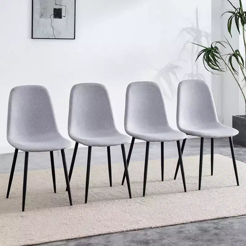 A set of 4 grey fabric-backed and metal combination spoon chairs - a perfect match for minimalist and Scandinavian-style home decor