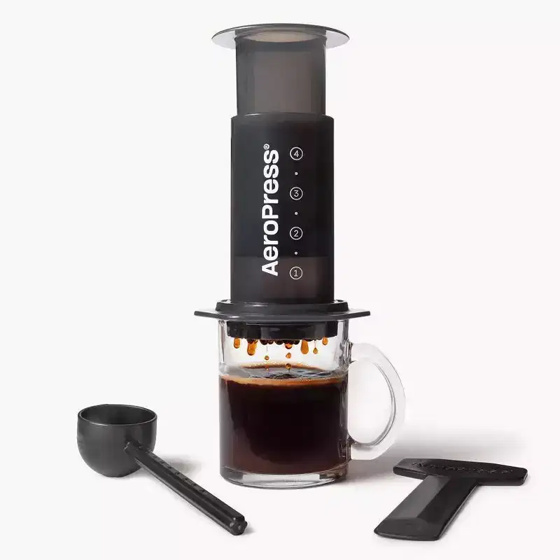 AeroPress Original Coffee Press: Manual Single Serve Coffee Maker, 8 oz Capacity, Includes Scoop & Paper Filters, Black